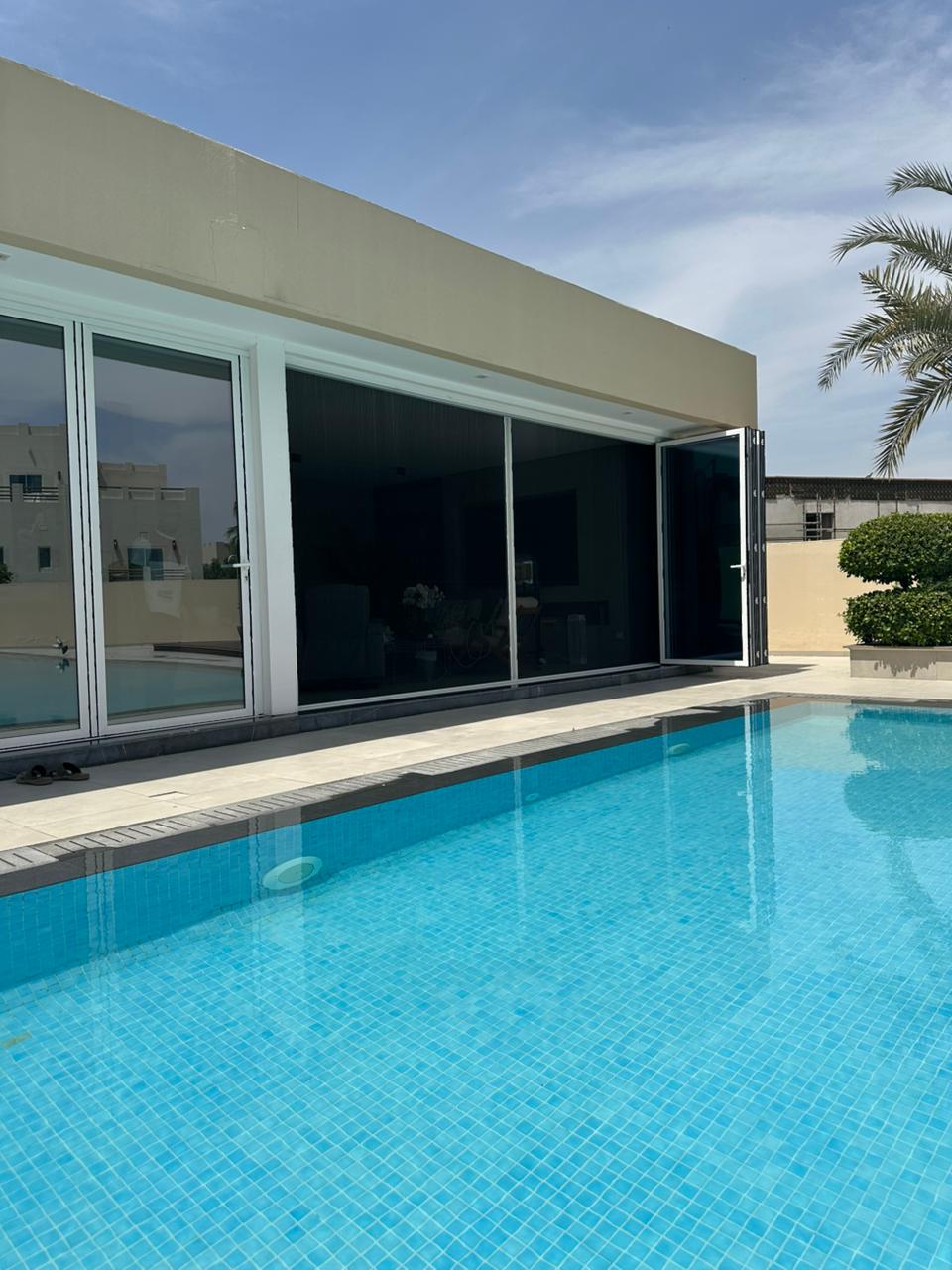 Sliding screen track and roller detail on a Dubai door