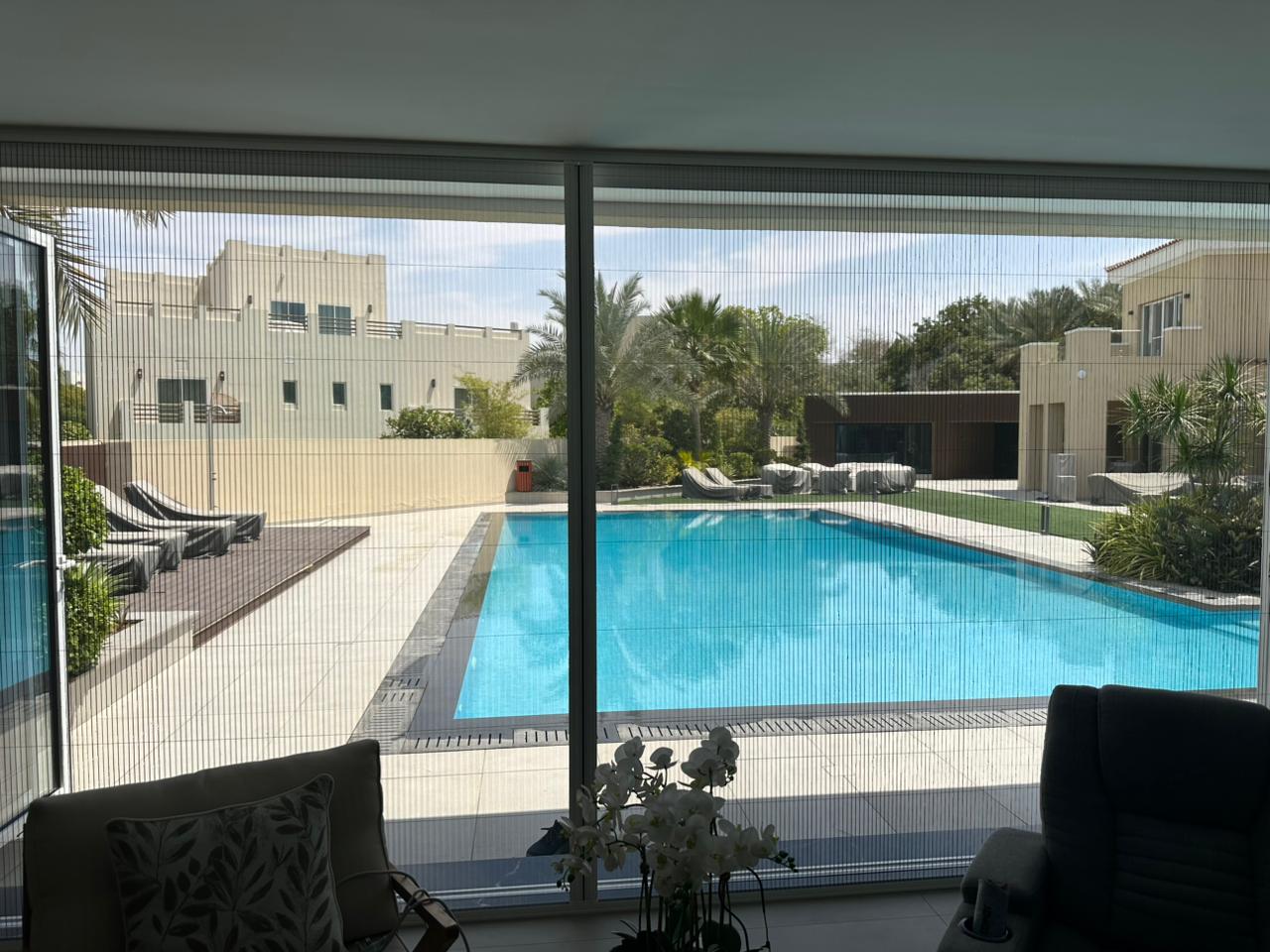 Sliding insect screen on a balcony glass door in Dubai