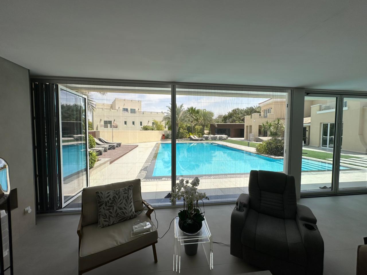 Twin-track sliding screen on a villa patio door in Dubai