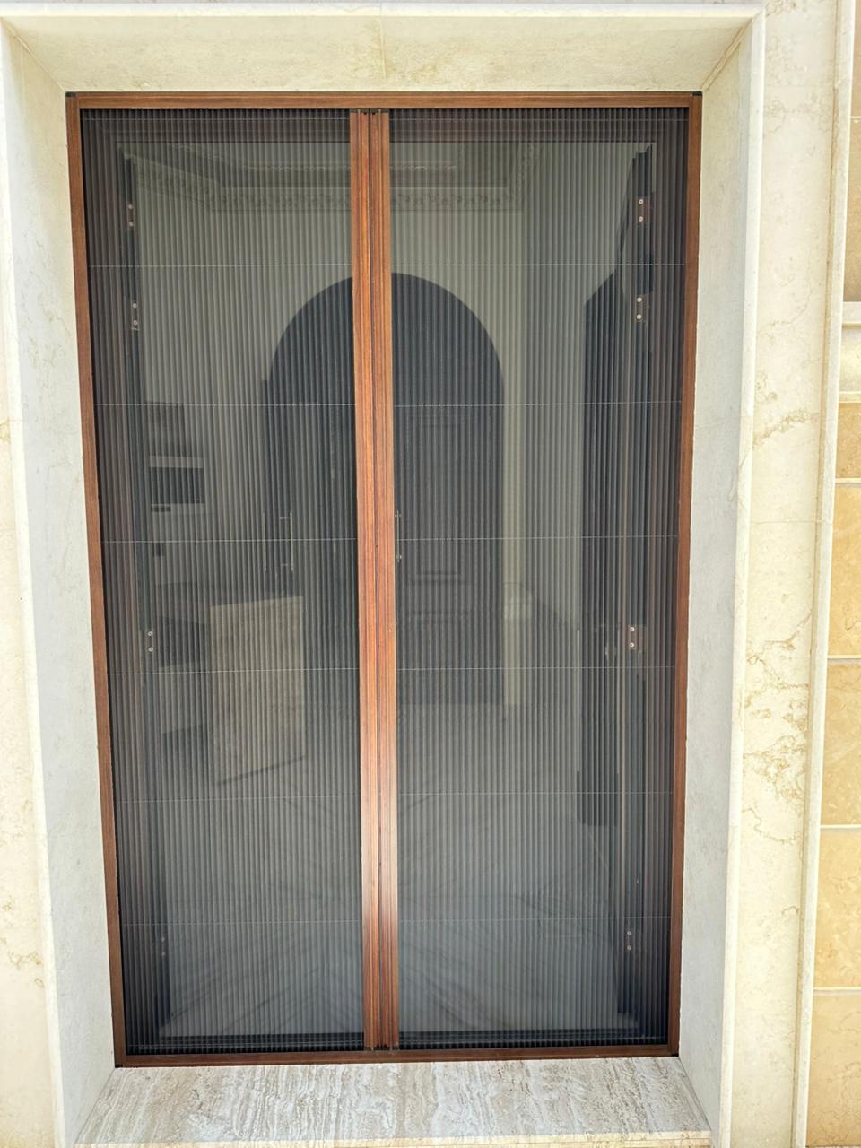 Shopfront screen fitted to a retail unit in Al Qusais