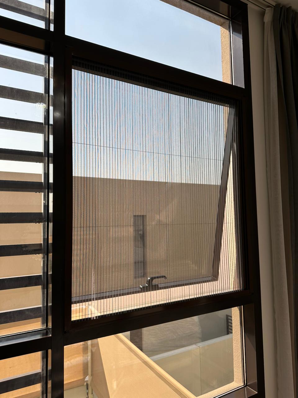 Close-up of a fine insect mesh fitted to a window screen in Dubai
